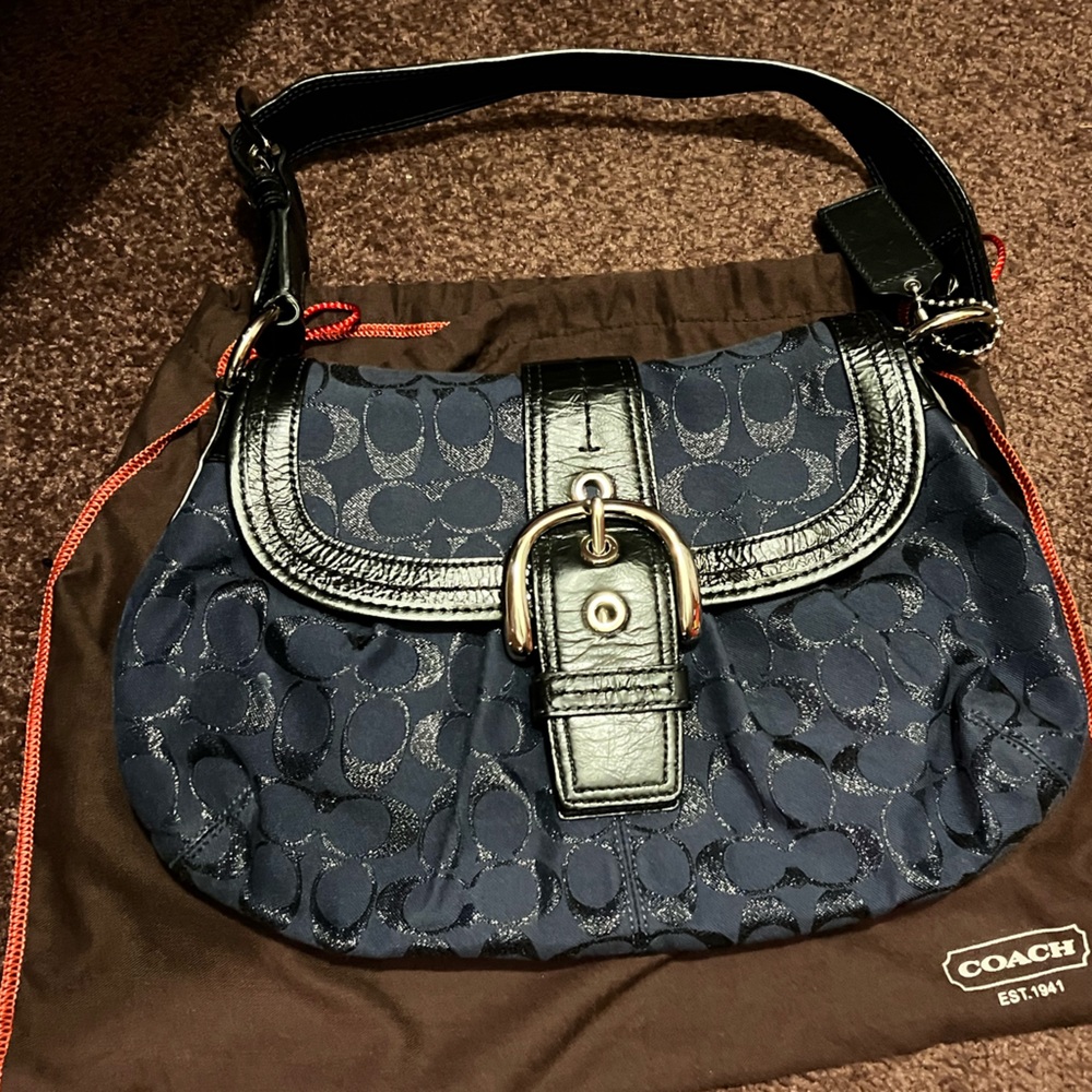 Navy and black coach purse with buckle detail.   Gently used.